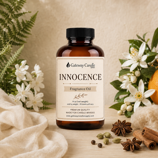 Innocence fragrance oil bottle surrounded by ingredients representing its scent notes